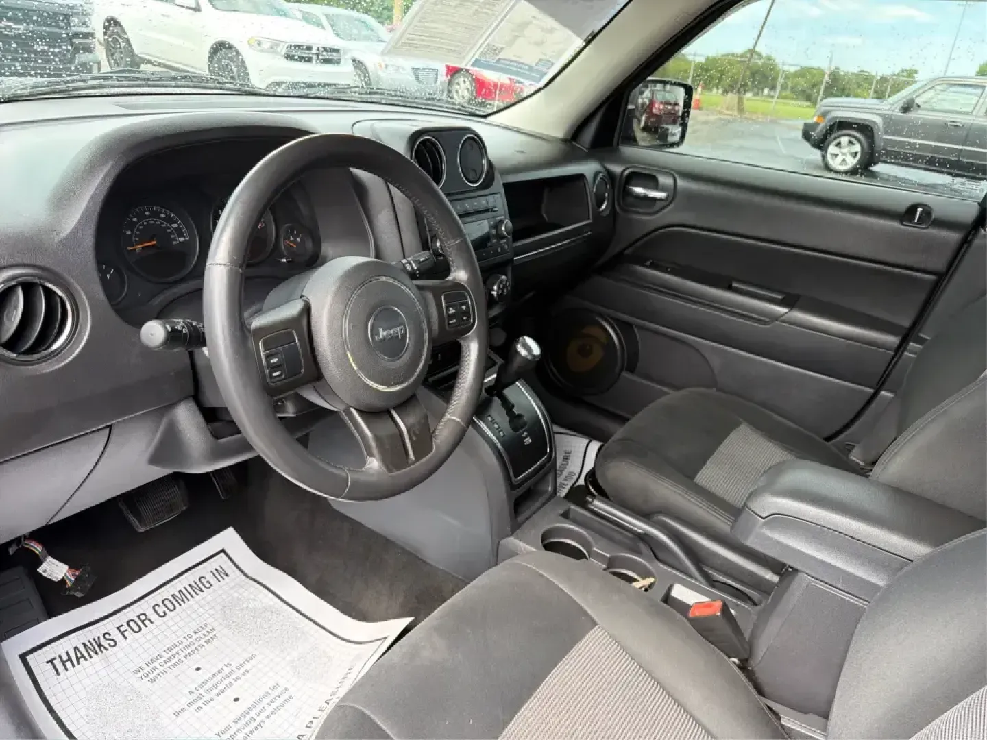 2015 Jeep Patriot Latitude 4WD (1C4NJRFB8FD) with an 2.4L L4 DOHC 16V engine, located at 401 Woodman Dr, Riverside, OH, 45431, (937) 908-9800, 39.760899, -84.123421 - Weekend getaways, snowy commutes, and everyday errands feel a lot easier when you've got an SUV that's ready for whatever Ohio throws your way. This **2015 Jeep Patriot Latitude 4WD** is a practical choice for drivers who want confident traction, versatile cargo space, and a comfortable cabin for fi- Photo#9