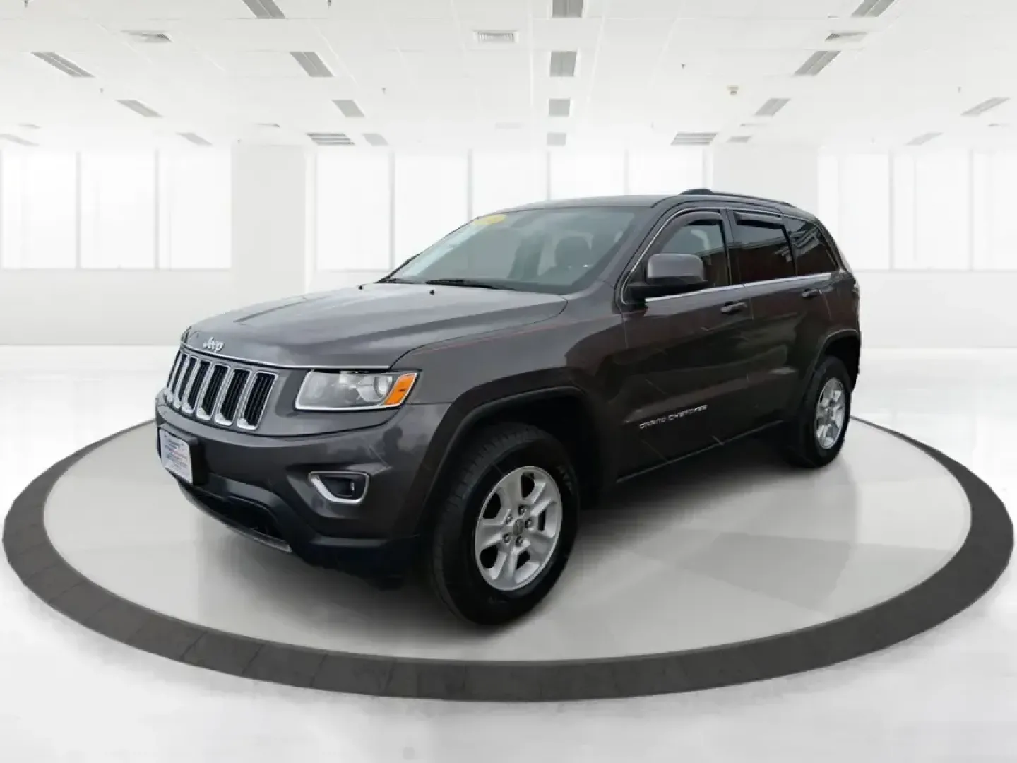 2015 Jeep Grand Cherokee Laredo (1C4RJFAG5FC) with an 3.6L V-6 DOHC engine, 8-Speed Automatic transmission, located at 1951 S Dayton Lakeview Rd., New Carlisle, OH, 45344, (937) 908-9800, 39.890999, -84.050255 - Need one SUV that can handle school drop-offs in the morning, a smooth I75 commute at lunchtime, and a last-minute weekend escape to the Miami Valley trails? This 2015 Jeep Grand Cherokee Laredo 4WD is built for real life in Troy, Ohio-comfortable enough for daily driving, confident enough for unpre - Photo#8
