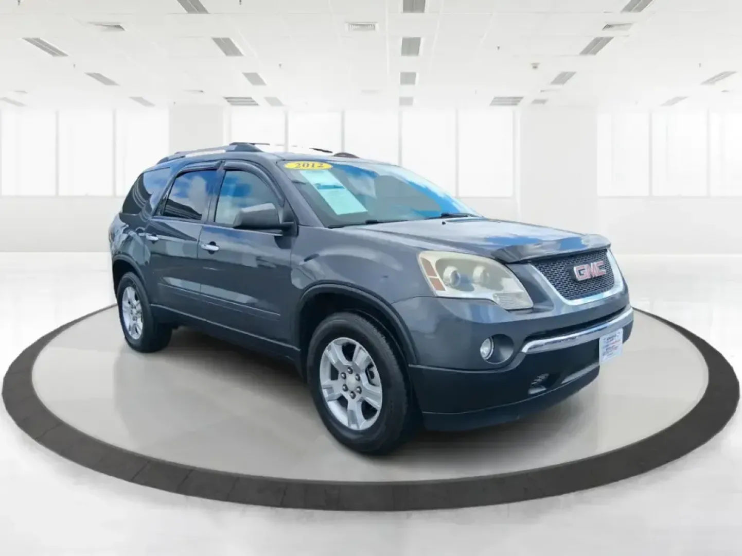 2012 GMC Acadia SL (1GKKRNED6CJ) with an 3.6L V-6 gasoline direct injection engine, 6-Speed Automatic transmission, located at 8750 N County Rd 25A, Piqua, OH, 45356, (937) 908-9800, 40.164391, -84.232513 - Pack up the kids, load the cooler, and point the SUV toward your next weekend getaway-this 2012 GMC Acadia SL is built for real-life Ohio driving, from school drop-offs and long commutes to road trips up I-75 and errands around Piqua. With three-row versatility, confident road manners, and family-fr - Photo#0