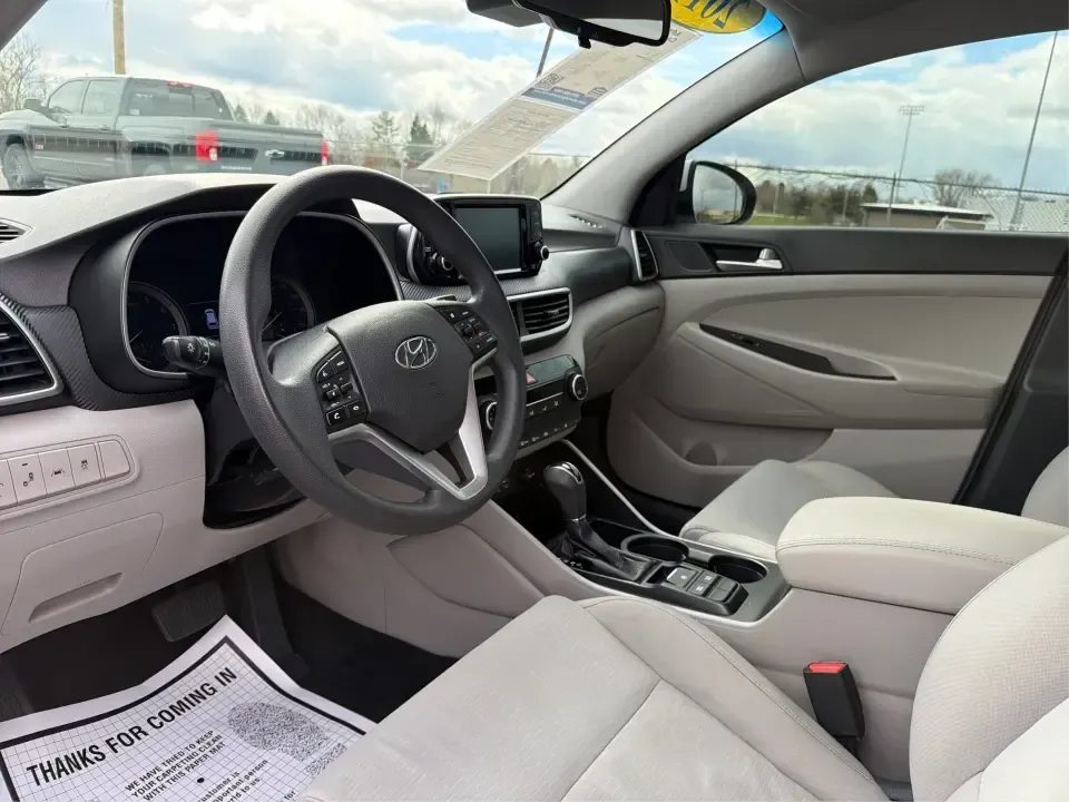 2019 Hyundai Tucson Value (KM8J33A41KU) with an Nu 2L I-4 gasoline direct injection engine, 6A transmission, located at 8750 N County Rd 25A, Piqua, OH, 45356, (937) 908-9800, 40.164391, -84.232513 - Picture your next Ohio weekend: loading up the cooler, tossing sports gear in the back, and cruising from Piqua to a family cookout or a quick getaway-without stressing about space, comfort, or the road ahead. This **2019 Hyundai Tucson Value** in **White Pearl** is the kind of compact SUV that fits - Photo#9