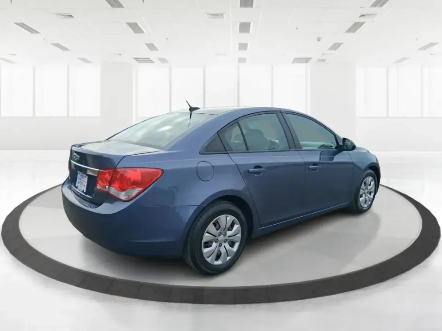 2014 Chevrolet Cruze LS Auto (1G1PA5SG7E7) with an ECOTEC 1.8L I-4 DOHC engine, 6-Speed Automatic transmission, located at 401 Woodman Dr, Riverside, OH, 45431, (937) 908-9800, 39.760899, -84.123421 - Picture a dependable daily commuter that still feels comfortable for weekend errands, school drop-offs, and the occasional road trip down I-675 or US-35-this 2014 Chevrolet Cruze LS Auto is the kind of practical sedan that fits real life in the Dayton area. Finished in Atlantis Blue Metallic, it's e - Photo#2