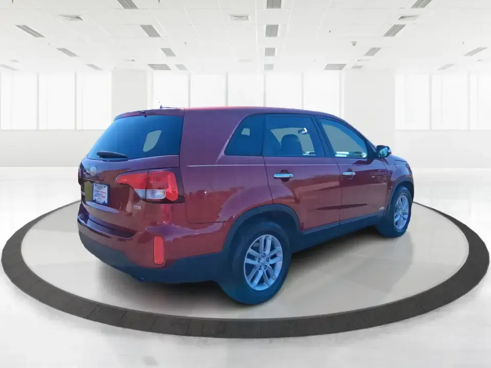 2015 Kia Sorento LX (5XYKTCA67FG) with an 2.4L I-4 gasoline direct injection engine, 6-Speed Automatic transmission, located at 1951 S Dayton Lakeview Rd., New Carlisle, OH, 45344, (937) 908-9800, 39.890999, -84.050255 - Weekend road trips to John Bryan State Park, busy school mornings, or a long commute down I70-this 2015 Kia Sorento LX is the kind of SUV that fits real life in the Miami Valley. Finished in eye-catching Remington Red Metallic, it's a practical, confidence-inspiring choice for growing families, outd - Photo#2
