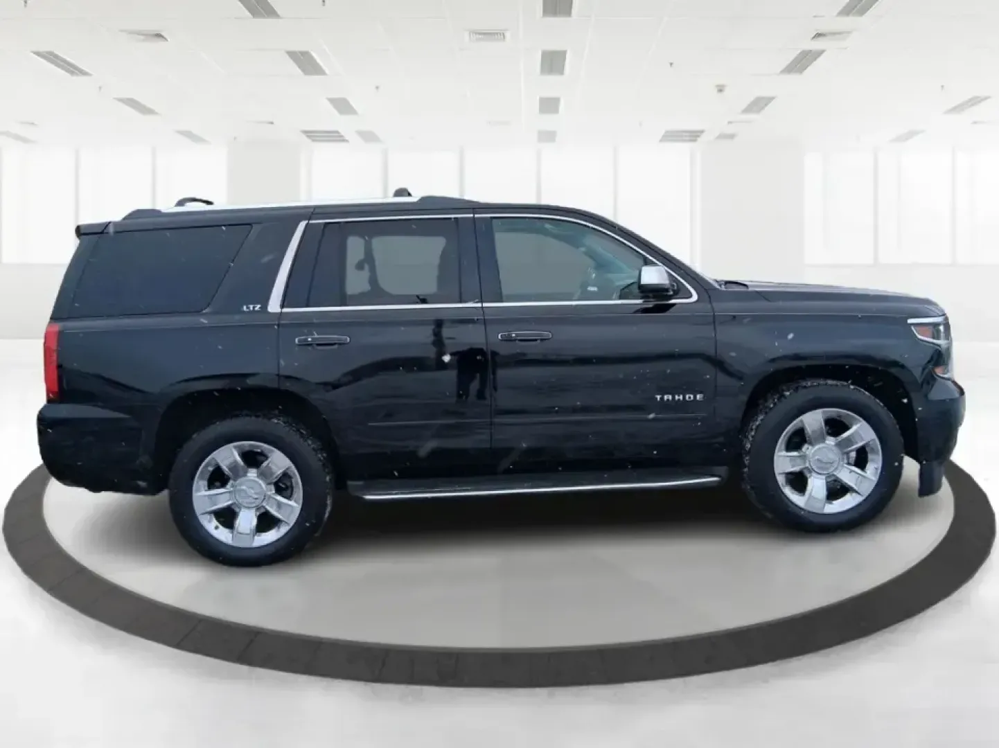 2015 Chevrolet Tahoe LTZ (1GNSKCKC9FR) with an EcoTec3 5.3L V-8 gasoline direct injection engine, 6-Speed Automatic transmission, located at 4508 South Dixie Dr, Moraine, OH, 45439, (937) 908-9800, 39.689976, -84.218452 - Big family weekend at Indian Lake, a road-trip up I-75, or a daily commute with room for coworkers and gear-this 2015 Chevrolet Tahoe LTZ 4WD is built for the kind of life that doesn't fit in a small SUV. Finished in sleek Black and powered by the EcoTec3 5.3L V8 with a smooth 6-speed automatic tran - Photo#1