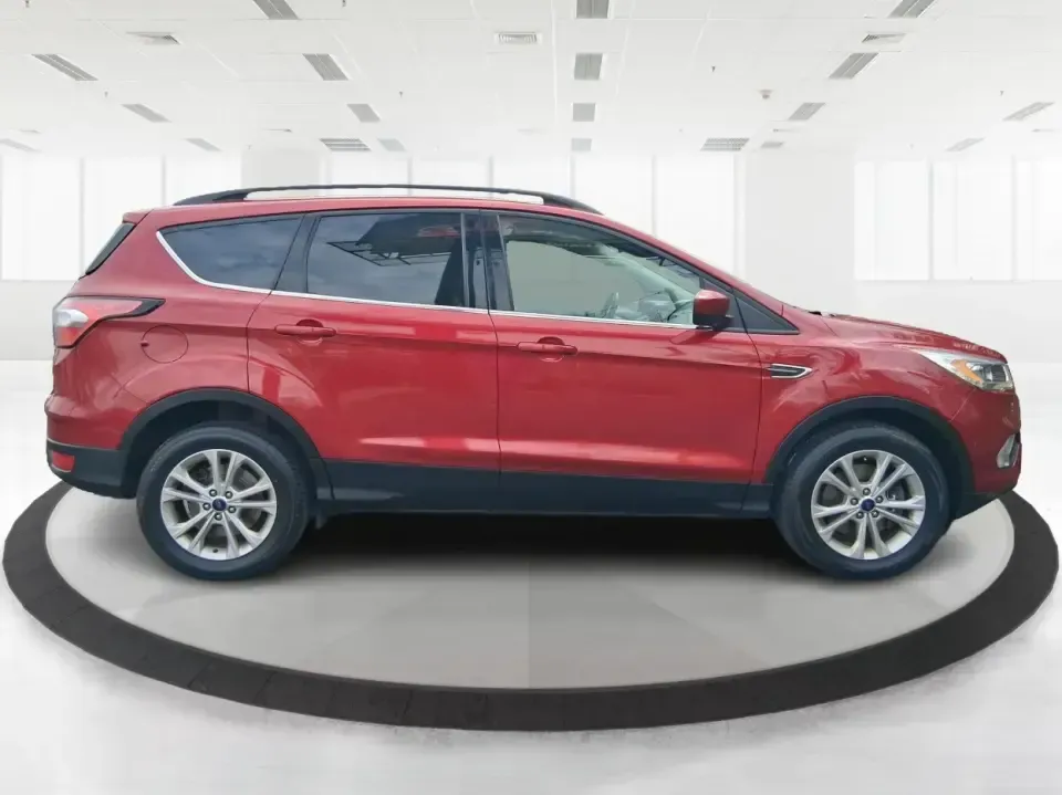 2018 Ford Escape SEL (1FMCU9HD2JU) with an 1.5L L4 DOHC 16V engine, 6A transmission, located at 401 Woodman Dr, Riverside, OH, 45431, (937) 908-9800, 39.760899, -84.123421 - Need a do-it-all SUV that can handle the weekday commute on I-675, quick school drop-offs near Wright-Patterson AFB, and spontaneous weekend getaways to Carillon Historical Park or a lap around Eastwood MetroPark? This 2018 Ford Escape SEL in Ruby Red Metallic Tinted Clearcoat is built for real-life - Photo#1