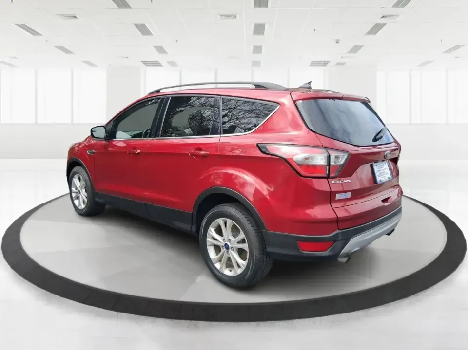 2018 Ford Escape SEL (1FMCU9HD2JU) with an 1.5L L4 DOHC 16V engine, 6A transmission, located at 401 Woodman Dr, Riverside, OH, 45431, (937) 908-9800, 39.760899, -84.123421 - Need a do-it-all SUV that can handle the weekday commute on I-675, quick school drop-offs near Wright-Patterson AFB, and spontaneous weekend getaways to Carillon Historical Park or a lap around Eastwood MetroPark? This 2018 Ford Escape SEL in Ruby Red Metallic Tinted Clearcoat is built for real-life - Photo#4