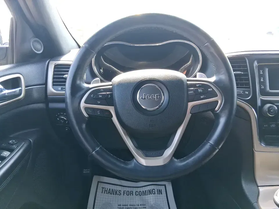 2015 Jeep Grand Cherokee Laredo (1C4RJFAG4FC) with an 3.6L V-6 DOHC engine, 8-Speed Automatic transmission, located at 1230 East Main St, Xenia, OH, 45385, (937) 908-9800, 39.688026, -83.910172 - Weekend getaways to Hocking Hills, confident winter drives to work, and comfortable family errands around town all get easier in a capable SUV like this 2015 Jeep Grand Cherokee Laredo 4WD. Finished in Maximum Steel Metallic Clearcoat, this Grand Cherokee blends rugged Jeep attitude with everyday co - Photo#16