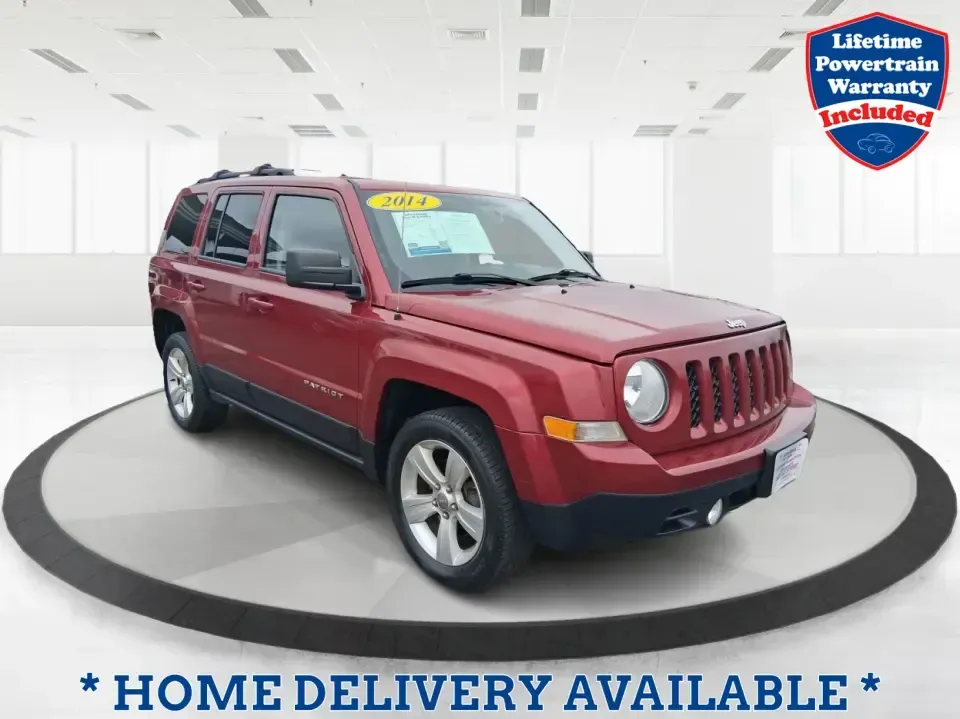 2014 Jeep Patriot Latitude 2WD (1C4NJPFB3ED) with an 2.4L L4 DOHC 16V engine, located at 8750 N County Rd 25A, Piqua, OH, 45356, (937) 908-9800, 40.164391, -84.232513 - Picture a weekday commute down I70 followed by a Saturday escape to parks and backroads around Clark County-this 2014 Jeep Patriot Latitude is the kind of compact SUV that fits both routines without feeling oversized. Finished in Deep Cherry Red Crystal Pearlcoat and showing 90,565 miles, it's a pra- Photo#0