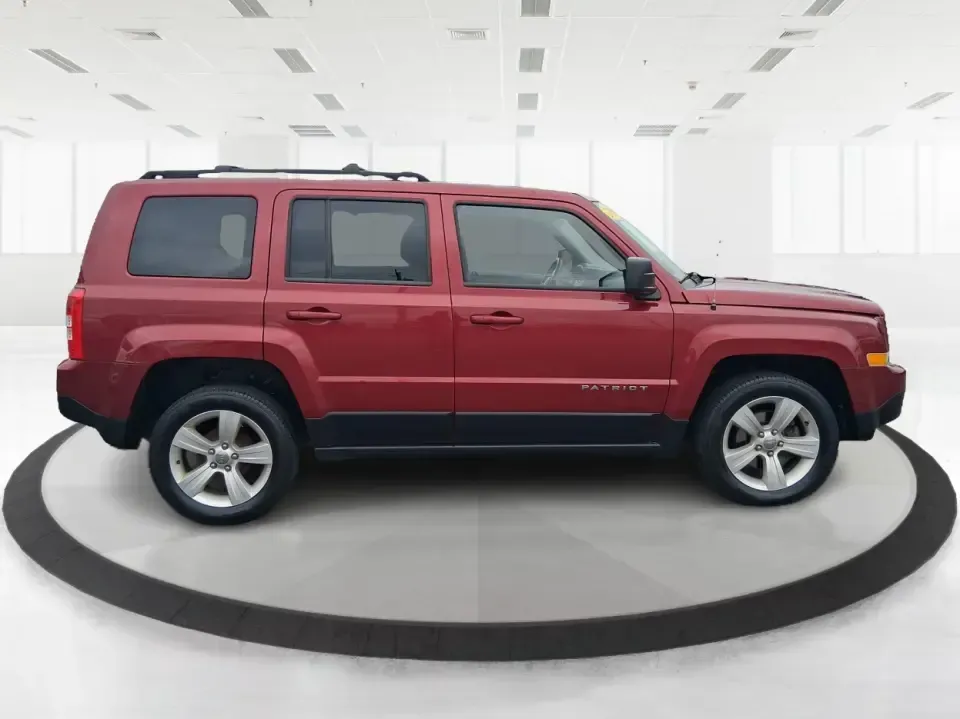 2014 Jeep Patriot Latitude 2WD (1C4NJPFB3ED) with an 2.4L L4 DOHC 16V engine, located at 8750 N County Rd 25A, Piqua, OH, 45356, (937) 908-9800, 40.164391, -84.232513 - Picture a weekday commute down I70 followed by a Saturday escape to parks and backroads around Clark County-this 2014 Jeep Patriot Latitude is the kind of compact SUV that fits both routines without feeling oversized. Finished in Deep Cherry Red Crystal Pearlcoat and showing 90,565 miles, it's a pra- Photo#1