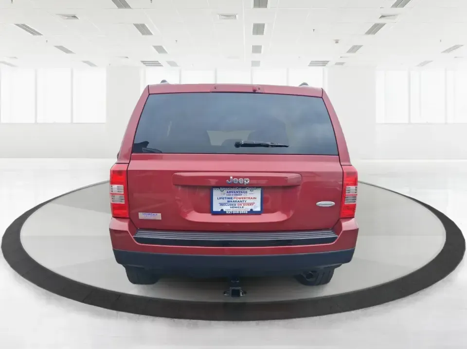 2014 Jeep Patriot Latitude 2WD (1C4NJPFB3ED) with an 2.4L L4 DOHC 16V engine, located at 8750 N County Rd 25A, Piqua, OH, 45356, (937) 908-9800, 40.164391, -84.232513 - Picture a weekday commute down I70 followed by a Saturday escape to parks and backroads around Clark County-this 2014 Jeep Patriot Latitude is the kind of compact SUV that fits both routines without feeling oversized. Finished in Deep Cherry Red Crystal Pearlcoat and showing 90,565 miles, it's a pra- Photo#3