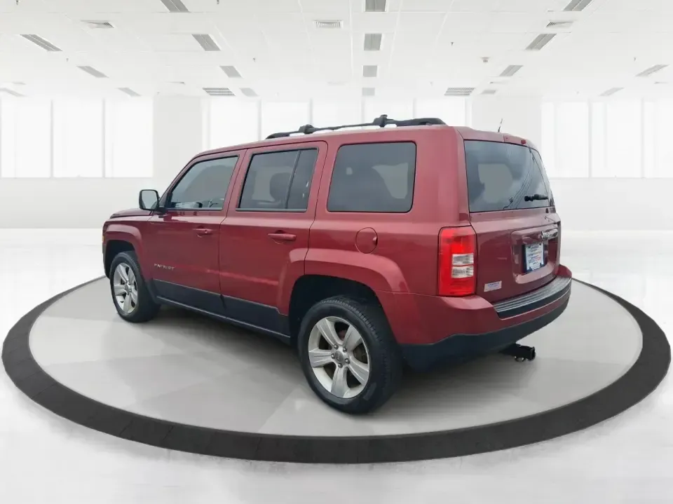 2014 Jeep Patriot Latitude 2WD (1C4NJPFB3ED) with an 2.4L L4 DOHC 16V engine, located at 8750 N County Rd 25A, Piqua, OH, 45356, (937) 908-9800, 40.164391, -84.232513 - Picture a weekday commute down I70 followed by a Saturday escape to parks and backroads around Clark County-this 2014 Jeep Patriot Latitude is the kind of compact SUV that fits both routines without feeling oversized. Finished in Deep Cherry Red Crystal Pearlcoat and showing 90,565 miles, it's a pra- Photo#4