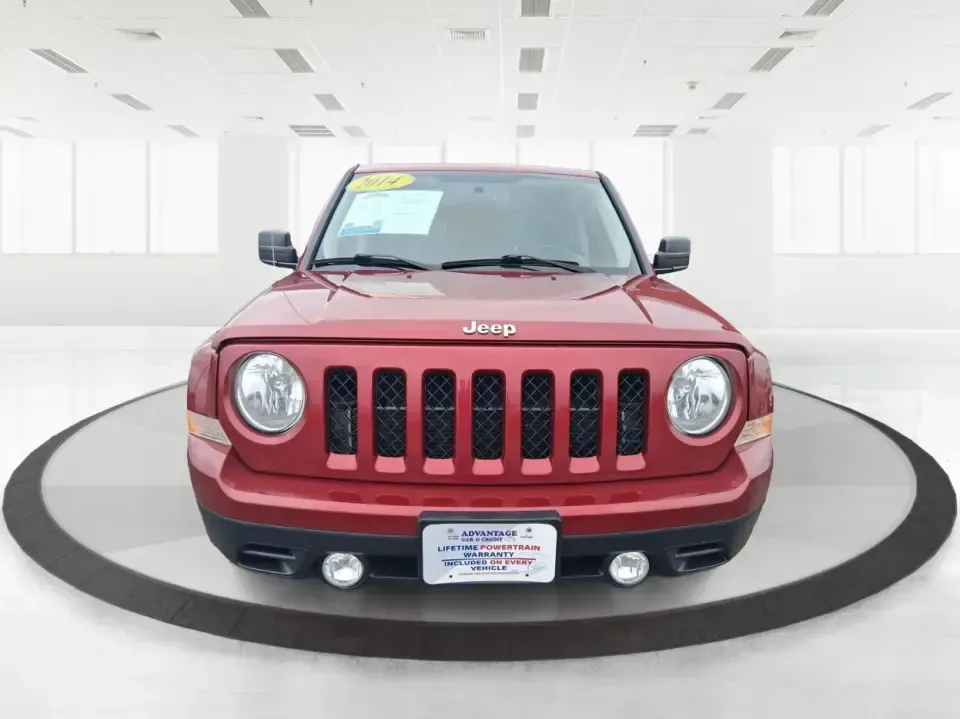 2014 Jeep Patriot Latitude 2WD (1C4NJPFB3ED) with an 2.4L L4 DOHC 16V engine, located at 8750 N County Rd 25A, Piqua, OH, 45356, (937) 908-9800, 40.164391, -84.232513 - Picture a weekday commute down I70 followed by a Saturday escape to parks and backroads around Clark County-this 2014 Jeep Patriot Latitude is the kind of compact SUV that fits both routines without feeling oversized. Finished in Deep Cherry Red Crystal Pearlcoat and showing 90,565 miles, it's a pra- Photo#7