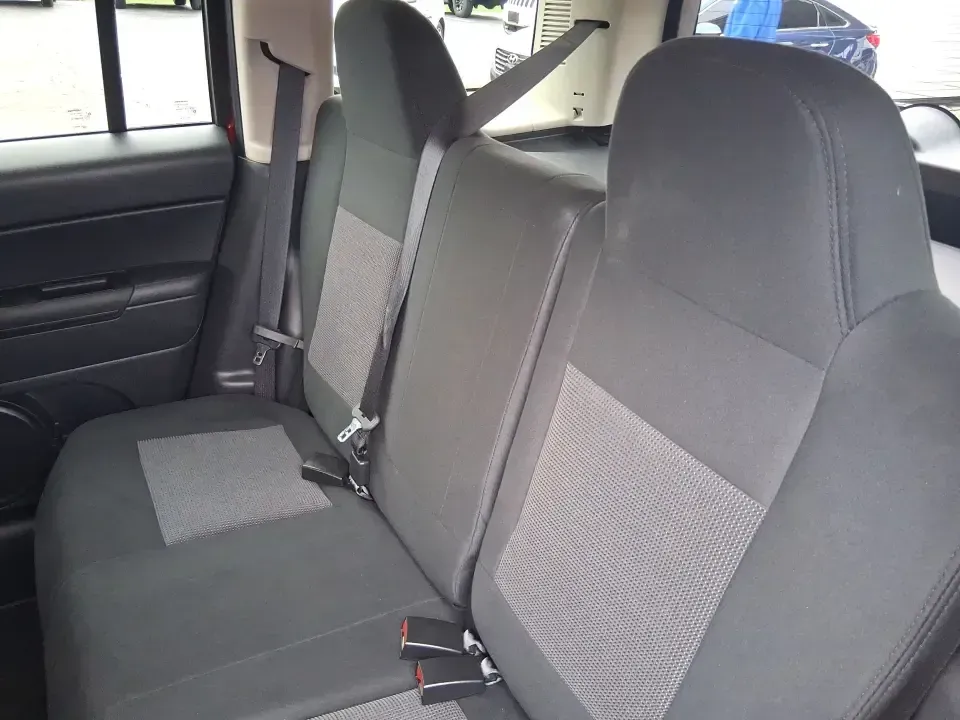 2014 Jeep Patriot Latitude 2WD (1C4NJPFB3ED) with an 2.4L L4 DOHC 16V engine, located at 8750 N County Rd 25A, Piqua, OH, 45356, (937) 908-9800, 40.164391, -84.232513 - Picture a weekday commute down I70 followed by a Saturday escape to parks and backroads around Clark County-this 2014 Jeep Patriot Latitude is the kind of compact SUV that fits both routines without feeling oversized. Finished in Deep Cherry Red Crystal Pearlcoat and showing 90,565 miles, it's a pra- Photo#10
