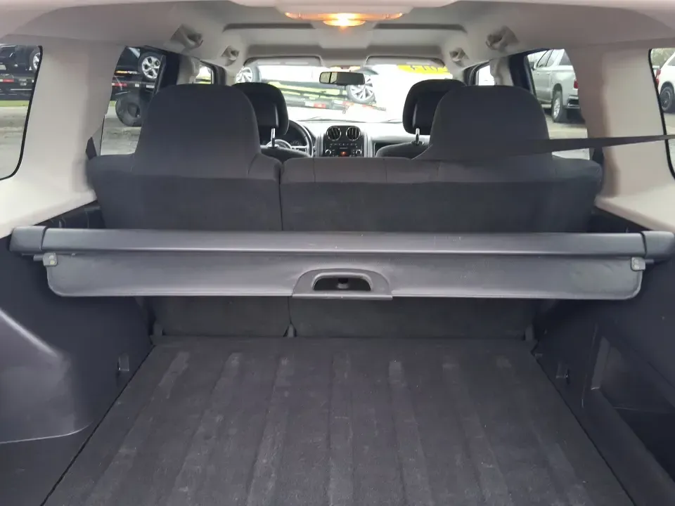 2014 Jeep Patriot Latitude 2WD (1C4NJPFB3ED) with an 2.4L L4 DOHC 16V engine, located at 8750 N County Rd 25A, Piqua, OH, 45356, (937) 908-9800, 40.164391, -84.232513 - Picture a weekday commute down I70 followed by a Saturday escape to parks and backroads around Clark County-this 2014 Jeep Patriot Latitude is the kind of compact SUV that fits both routines without feeling oversized. Finished in Deep Cherry Red Crystal Pearlcoat and showing 90,565 miles, it's a pra- Photo#12