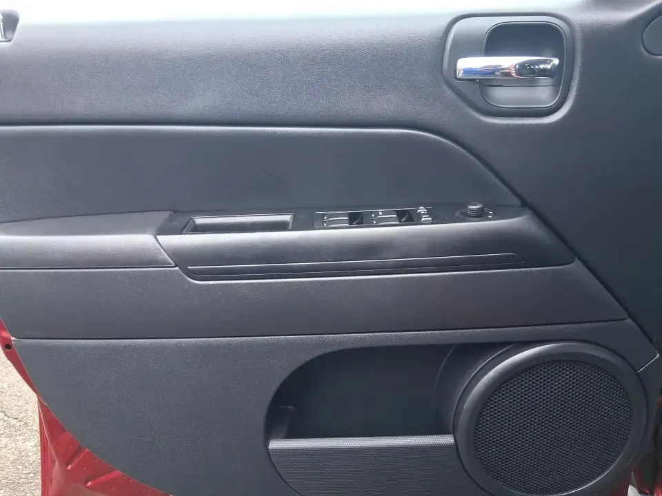 2014 Jeep Patriot Latitude 2WD (1C4NJPFB3ED) with an 2.4L L4 DOHC 16V engine, located at 8750 N County Rd 25A, Piqua, OH, 45356, (937) 908-9800, 40.164391, -84.232513 - Picture a weekday commute down I70 followed by a Saturday escape to parks and backroads around Clark County-this 2014 Jeep Patriot Latitude is the kind of compact SUV that fits both routines without feeling oversized. Finished in Deep Cherry Red Crystal Pearlcoat and showing 90,565 miles, it's a pra- Photo#17