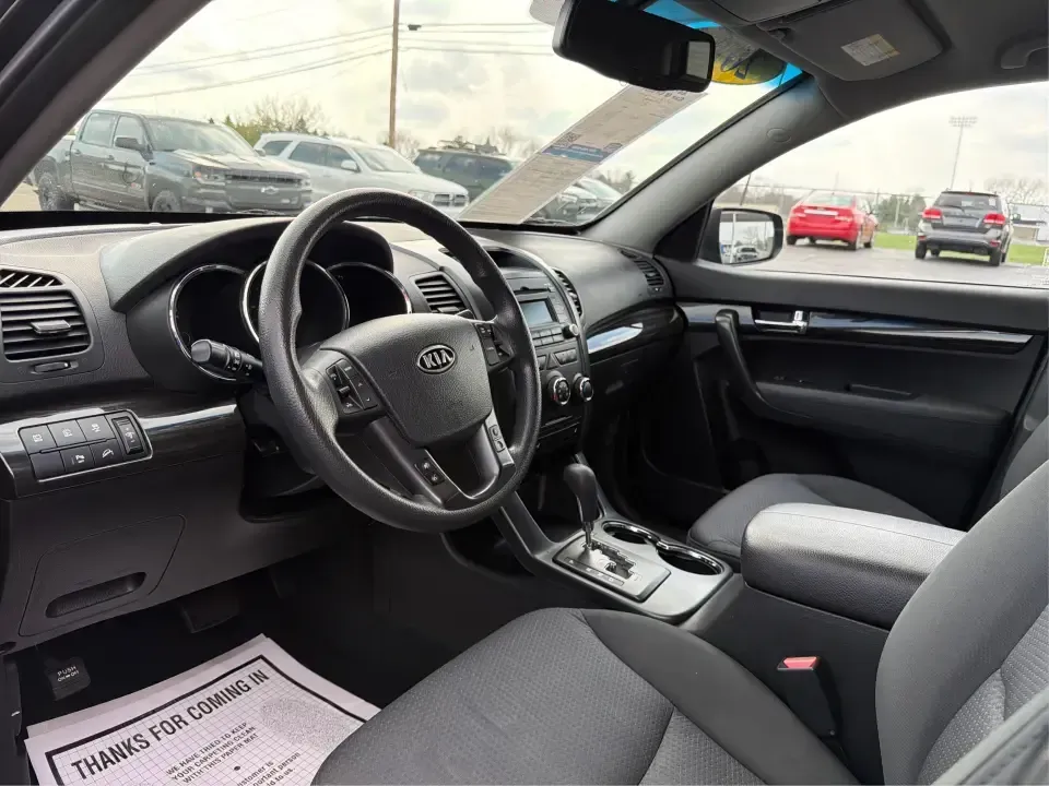 2012 Kia Sorento LX (5XYKT3A68CG) with an 2.4L I-4 gasoline direct injection engine, 6-Speed Automatic transmission, located at 1230 East Main St, Xenia, OH, 45385, (937) 908-9800, 39.688026, -83.910172 - Weekend getaways to John Bryan State Park, daily school drop-offs around Xenia, or an easy commute toward Beavercreek and Dayton-this Ebony Black 2012 Kia Sorento LX is the kind of SUV that fits real life. With practical space, confident road manners, and comfort features you'll appreciate on longer - Photo#9