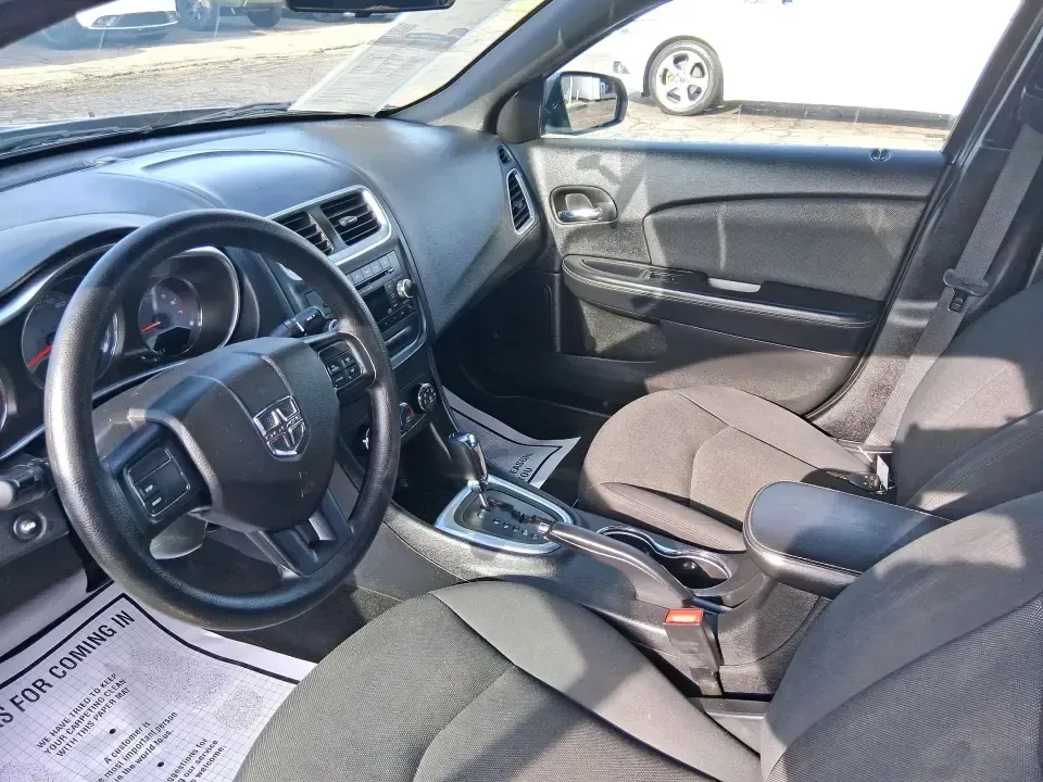 2014 Dodge Avenger SE (1C3CDZAB8EN) with an 2.4L L4 DOHC 16V engine, 4-Speed Automatic transmission, located at 1099 N County Rd 25A , Troy, OH, 45373, (937) 908-9800, 40.057079, -84.212883 - Picture an easy, stress-free daily commute from Moraine to downtown Dayton, with enough comfort for the school run, errands along South Dixie Drive, and the occasional weekend escape to Carillon Historical Park or a movie night near the Dayton Mall. If you want a practical sedan that fits real life- - Photo#9