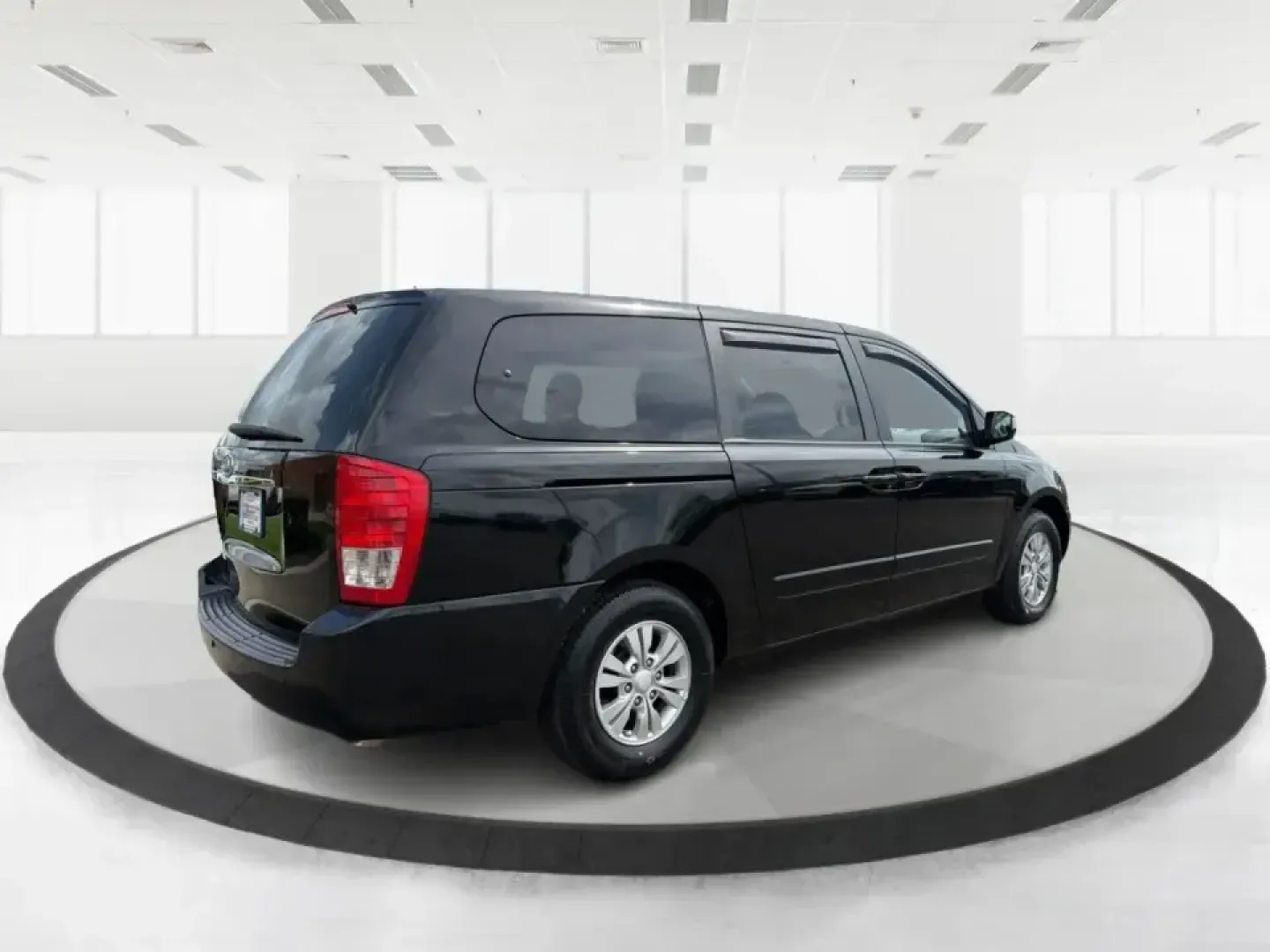 2012 Kia Sedona LX (KNDMG4C78C6) with an 3.5L V-6 DOHC engine, 5-Speed Automatic transmission, located at 1184 Kauffman Ave, Fairborn, OH, 45324, (937) 908-9800, 39.807072, -84.030914 - Picture the next family road trip, soccer Saturday, or airport pickup where everyone actually fits comfortably-plus there's room left for groceries, strollers, and weekend gear. This 2012 Kia Sedona LX in Aurora Black is built for real life: school drop-offs, long commutes across the Miami Valley, a - Photo#2