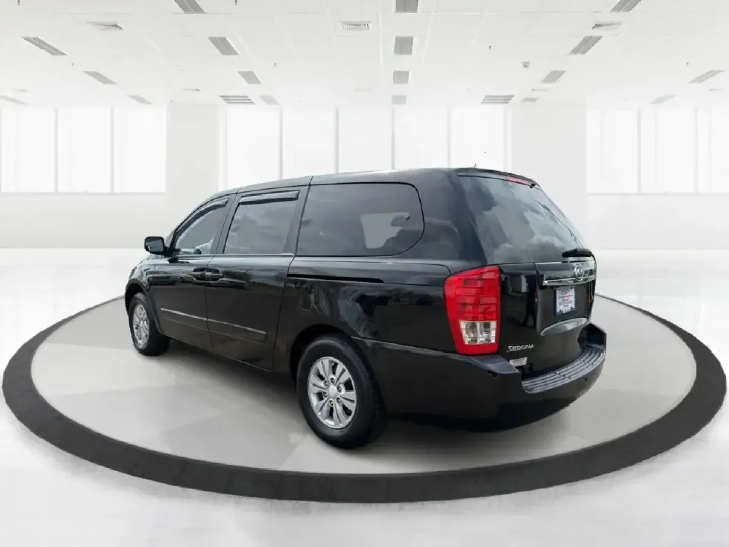 2012 Kia Sedona LX (KNDMG4C78C6) with an 3.5L V-6 DOHC engine, 5-Speed Automatic transmission, located at 1184 Kauffman Ave, Fairborn, OH, 45324, (937) 908-9800, 39.807072, -84.030914 - Picture the next family road trip, soccer Saturday, or airport pickup where everyone actually fits comfortably-plus there's room left for groceries, strollers, and weekend gear. This 2012 Kia Sedona LX in Aurora Black is built for real life: school drop-offs, long commutes across the Miami Valley, a - Photo#4