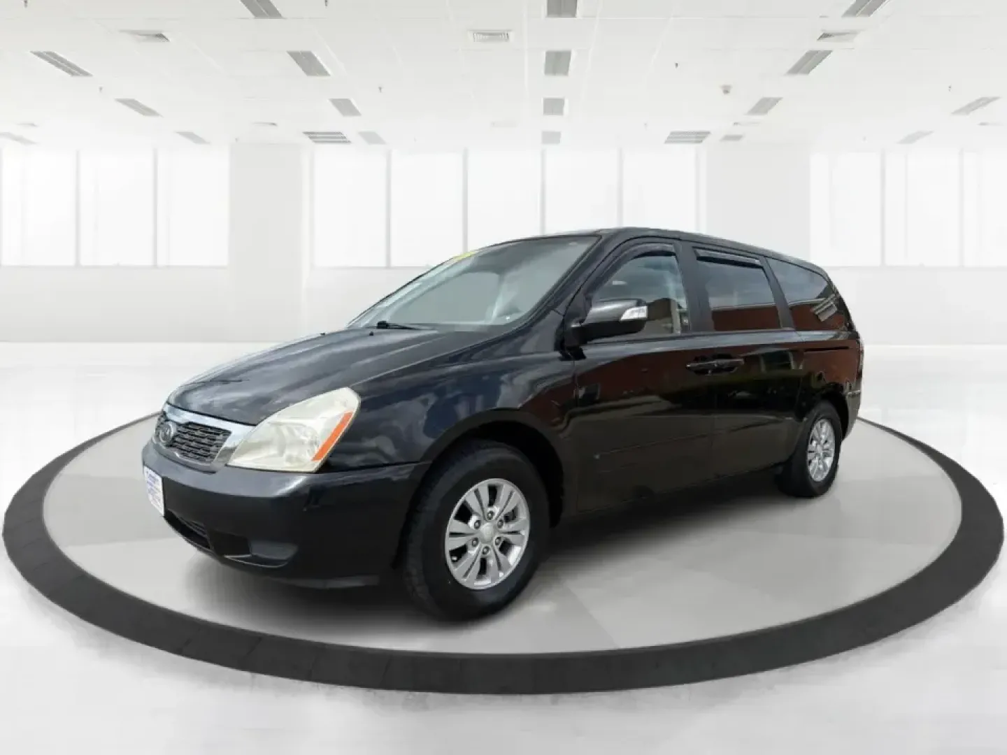 2012 Kia Sedona LX (KNDMG4C78C6) with an 3.5L V-6 DOHC engine, 5-Speed Automatic transmission, located at 1184 Kauffman Ave, Fairborn, OH, 45324, (937) 908-9800, 39.807072, -84.030914 - Picture the next family road trip, soccer Saturday, or airport pickup where everyone actually fits comfortably-plus there's room left for groceries, strollers, and weekend gear. This 2012 Kia Sedona LX in Aurora Black is built for real life: school drop-offs, long commutes across the Miami Valley, a - Photo#8