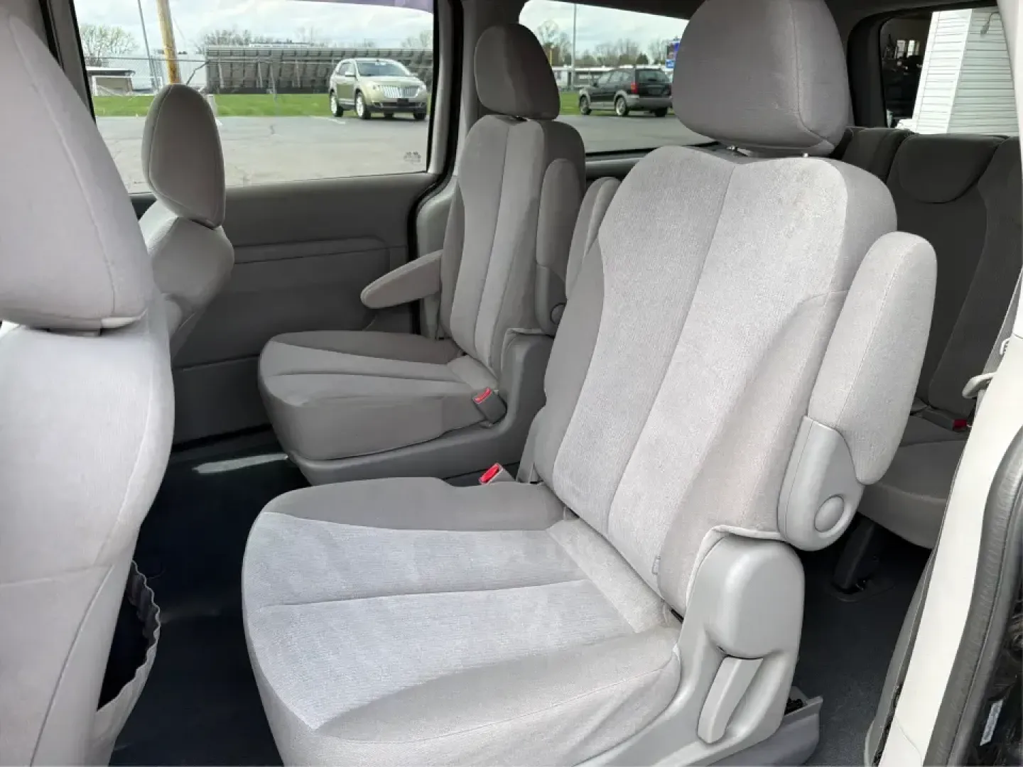 2012 Kia Sedona LX (KNDMG4C78C6) with an 3.5L V-6 DOHC engine, 5-Speed Automatic transmission, located at 1184 Kauffman Ave, Fairborn, OH, 45324, (937) 908-9800, 39.807072, -84.030914 - Picture the next family road trip, soccer Saturday, or airport pickup where everyone actually fits comfortably-plus there's room left for groceries, strollers, and weekend gear. This 2012 Kia Sedona LX in Aurora Black is built for real life: school drop-offs, long commutes across the Miami Valley, a - Photo#10