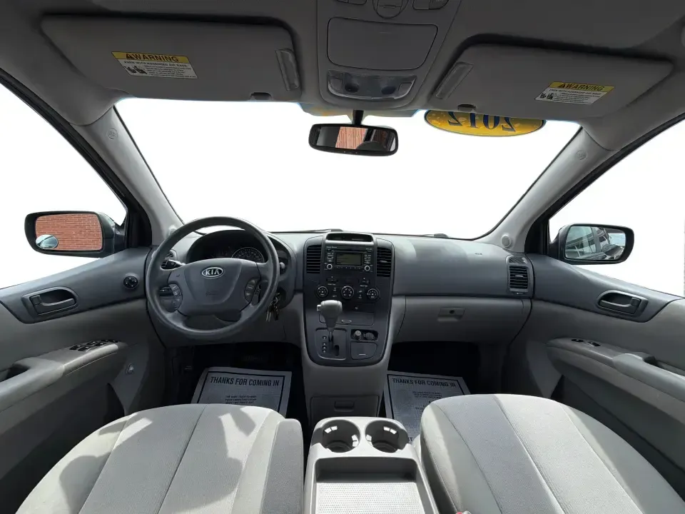 2012 Kia Sedona LX (KNDMG4C78C6) with an 3.5L V-6 DOHC engine, 5-Speed Automatic transmission, located at 401 Woodman Dr, Riverside, OH, 45431, (937) 908-9800, 39.760899, -84.123421 - Picture the next family road trip, soccer Saturday, or airport pickup where everyone actually fits comfortably-plus there's room left for groceries, strollers, and weekend gear. This 2012 Kia Sedona LX in Aurora Black is built for real life: school drop-offs, long commutes across the Miami Valley, a - Photo#19