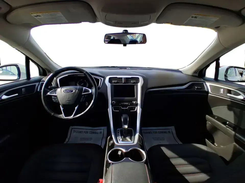 2016 Ford Fusion SE (3FA6P0H91GR) with an 2.0L L4 DOHC 16V engine, 6-Speed Automatic transmission, located at 880 E. National Road, Vandalia, OH, 45377, (937) 908-9800, 39.891918, -84.183594 - Need a dependable commuter that can handle I75 traffic, school drop-offs, and weekend runs to Dayton without draining your budget? This 2016 Ford Fusion SE in Oxford White is the kind of practical, comfortable sedan that fits real life in Vandalia-smooth for daily driving, efficient on regular unlea - Photo#21