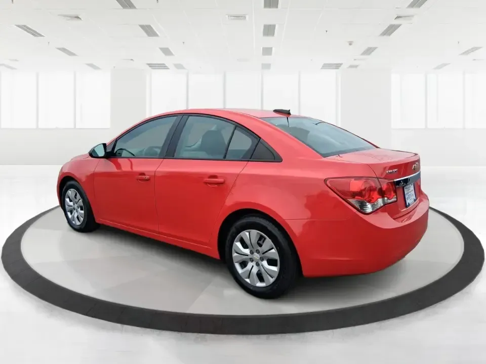 2015 Chevrolet Cruze LS Auto (1G1PA5SG9F7) with an ECOTEC 1.8L I-4 DOHC engine, 6-Speed Automatic transmission, located at 8750 N County Rd 25A, Piqua, OH, 45356, (937) 908-9800, 40.164391, -84.232513 - Picture an easy, affordable daily commute that still feels comfortable on I75, quick trips to downtown Piqua for dinner, and weekend errands that don't drain your budget at the pump. This 2015 Chevrolet Cruze LS Auto in eye-catching Red Hot is a smart, practical sedan for commuters, first-time buyer - Photo#4