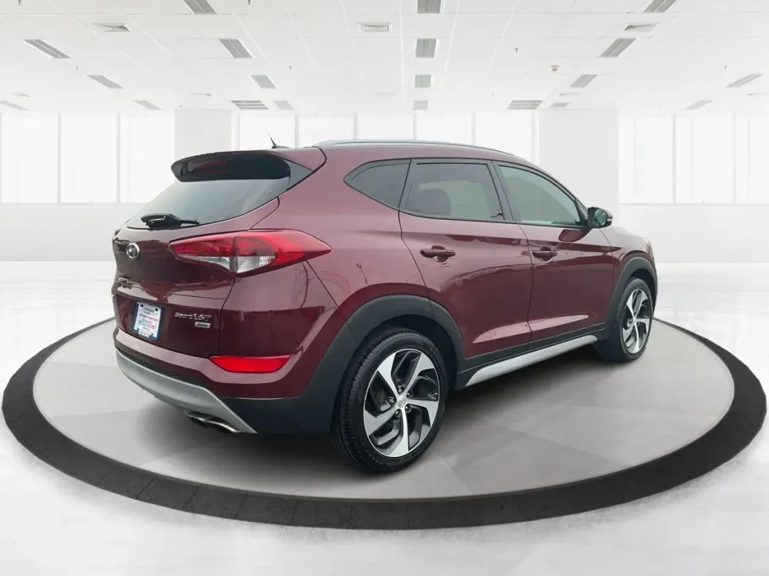 2017 Hyundai Tucson Sport (KM8J3CA29HU) with an 1.6L I-4 gasoline direct injection engine, located at 1951 S Dayton Lakeview Rd., New Carlisle, OH, 45344, (937) 908-9800, 39.890999, -84.050255 - **Discover Adventure in the 2017 Hyundai Tucson: Your Ideal SUV for Every Journey!**<br /> <br /> Are you ready to elevate your driving experience? The 2017 Hyundai Tucson in striking Ruby Wine is here, tailored for those who crave versatility and reliability in their daily adventures. Whether you'r - Photo#2