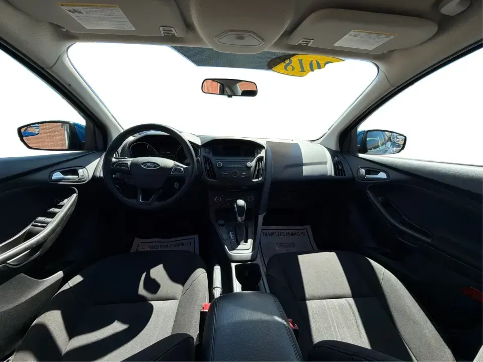 2018 Ford Focus SE (1FADP3FE5JL) with an 1.0L L3 engine, Automatic transmission, located at 1230 East Main St, Xenia, OH, 45385, (937) 908-9800, 39.688026, -83.910172 - Need a smart, budget-friendly commuter that's easy to live with all week and still ready for a spontaneous weekend escape? This 2018 Ford Focus SE sedan in eye-catching Lightning Blue Metallic is a practical pick for daily drives to Dayton, school drop-offs, and quick errands around Xenia-while keep - Photo#22