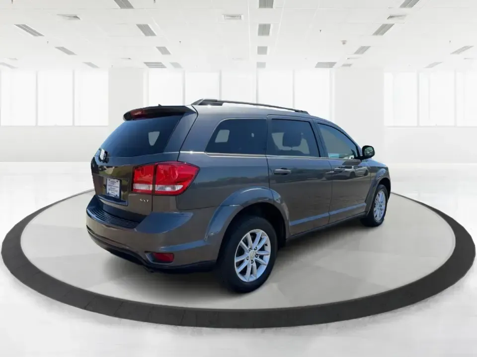 2014 Dodge Journey SXT (3C4PDDBG0ET) with an 3.6L V-6 DOHC engine, 6-Speed Automatic transmission, located at 1099 N County Rd 25A , Troy, OH, 45373, (937) 908-9800, 40.057079, -84.212883 - Pack up the kids, the dog, and the weekend bags-this 2014 Dodge Journey SXT is the kind of SUV that makes everyday life in Troy easier and spontaneous road trips feel completely doable. Whether you're tackling school drop-offs, commuting to Dayton, or planning a family day at the Miami County Fairgr - Photo#2