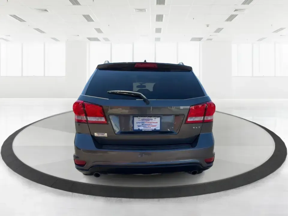 2014 Dodge Journey SXT (3C4PDDBG0ET) with an 3.6L V-6 DOHC engine, 6-Speed Automatic transmission, located at 1099 N County Rd 25A , Troy, OH, 45373, (937) 908-9800, 40.057079, -84.212883 - Pack up the kids, the dog, and the weekend bags-this 2014 Dodge Journey SXT is the kind of SUV that makes everyday life in Troy easier and spontaneous road trips feel completely doable. Whether you're tackling school drop-offs, commuting to Dayton, or planning a family day at the Miami County Fairgr - Photo#3