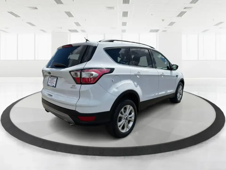 2018 Ford Escape SE (1FMCU0GD2JU) with an 1.5L L4 DOHC 16V engine, 6A transmission, located at 1951 S Dayton Lakeview Rd., New Carlisle, OH, 45344, (937) 908-9800, 39.890999, -84.050255 - Picture your next easy-to-live-with SUV: something that handles weekday commutes down I70, last-minute grocery runs near Brandt Pike, and weekend getaways to Buck Creek State Park without draining your budget. This 2018 Ford Escape SE is built for real life in Clark County-comfortable, efficient, an - Photo#2