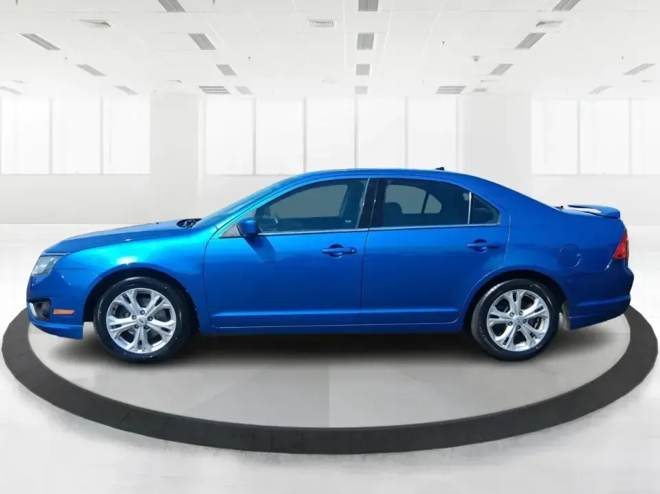 2012 Ford Fusion SE (3FAHP0HAXCR) with an 2.5L L4 DOHC 16V engine, located at 1099 N County Rd 25A , Troy, OH, 45373, (937) 908-9800, 40.057079, -84.212883 - Need a dependable sedan that makes everyday life easier-whether you're commuting down I-75 to Dayton, running errands around Troy, or planning a weekend drive past the Miami River and downtown's shops and festivals? This 2012 Ford Fusion SE in Blue Flame Metallic is a smart, comfortable choice for b - Photo#5