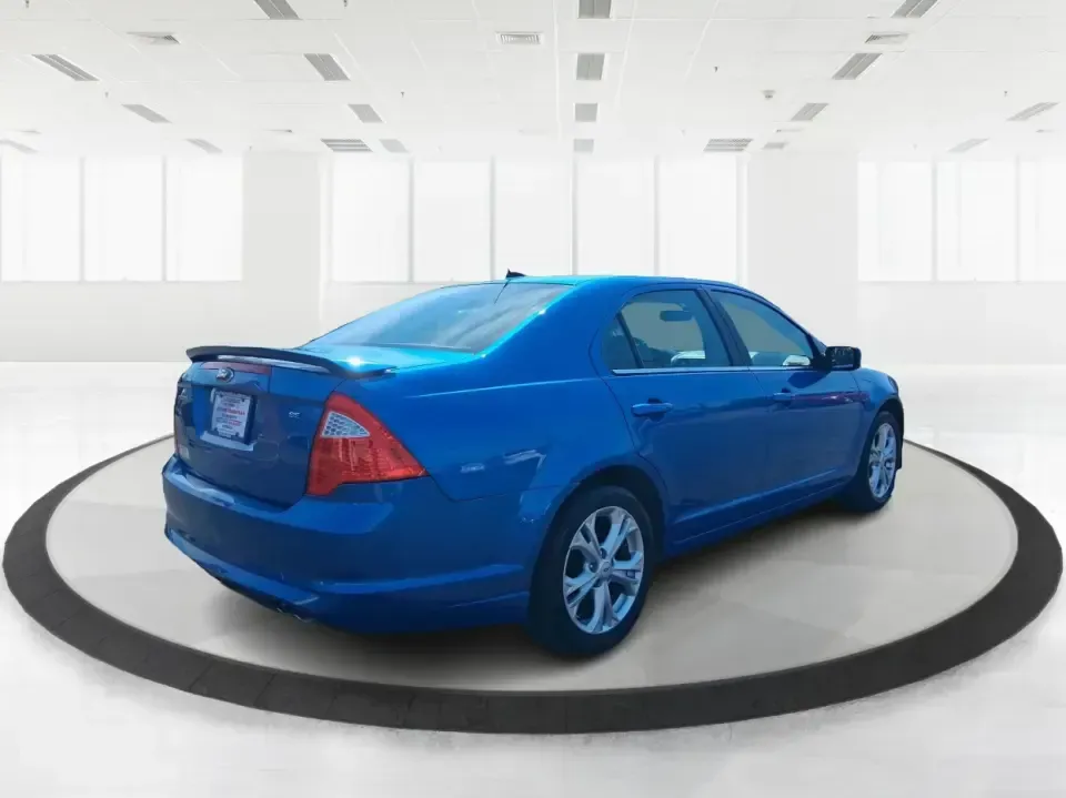 2012 Ford Fusion SE (3FAHP0HAXCR) with an 2.5L L4 DOHC 16V engine, located at 8750 N County Rd 25A, Piqua, OH, 45356, (937) 908-9800, 40.164391, -84.232513 - Need a dependable sedan that makes everyday life easier-whether you're commuting down I-75 to Dayton, running errands around Troy, or planning a weekend drive past the Miami River and downtown's shops and festivals? This 2012 Ford Fusion SE in Blue Flame Metallic is a smart, comfortable choice for b - Photo#2