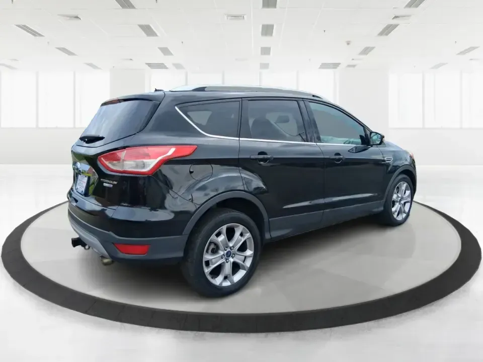 2014 Ford Escape Titanium (1FMCU9J99EU) with an 2.0L L4 DOHC 16V engine, 6-Speed Automatic transmission, located at 1099 N County Rd 25A , Troy, OH, 45373, (937) 908-9800, 40.057079, -84.212883 - Need one SUV that can handle an Ohio winter commute, school drop-offs, and a spontaneous weekend road trip to Hocking Hills without feeling like a compromise? This 2014 Ford Escape Titanium 4WD in sleek Tuxedo Black is built for real life in Troy-comfortable for long drives, confident in bad weather - Photo#2