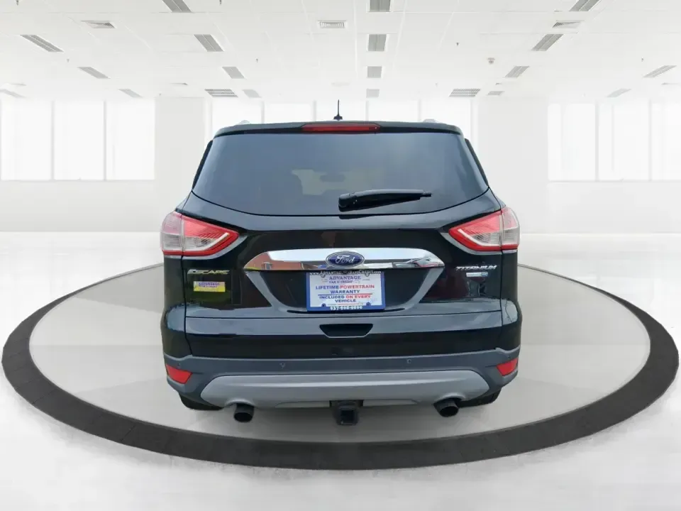 2014 Ford Escape Titanium (1FMCU9J99EU) with an 2.0L L4 DOHC 16V engine, 6-Speed Automatic transmission, located at 1099 N County Rd 25A , Troy, OH, 45373, (937) 908-9800, 40.057079, -84.212883 - Need one SUV that can handle an Ohio winter commute, school drop-offs, and a spontaneous weekend road trip to Hocking Hills without feeling like a compromise? This 2014 Ford Escape Titanium 4WD in sleek Tuxedo Black is built for real life in Troy-comfortable for long drives, confident in bad weather - Photo#3