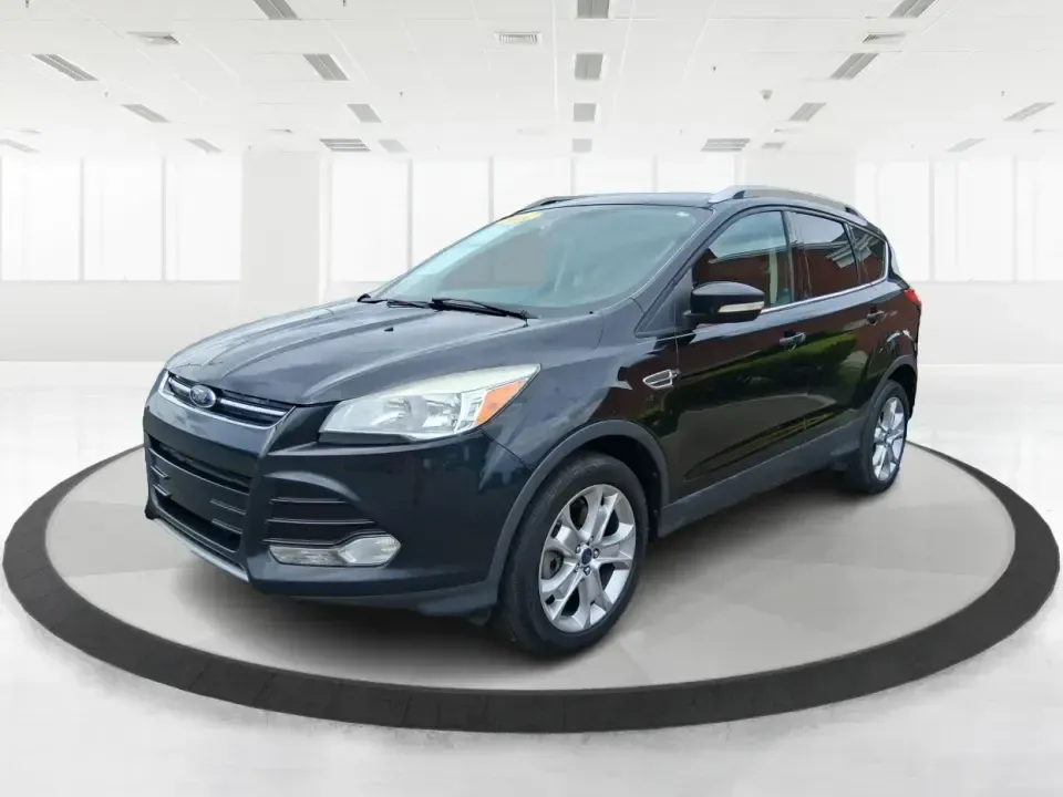 2014 Ford Escape Titanium (1FMCU9J99EU) with an 2.0L L4 DOHC 16V engine, 6-Speed Automatic transmission, located at 1099 N County Rd 25A , Troy, OH, 45373, (937) 908-9800, 40.057079, -84.212883 - Need one SUV that can handle an Ohio winter commute, school drop-offs, and a spontaneous weekend road trip to Hocking Hills without feeling like a compromise? This 2014 Ford Escape Titanium 4WD in sleek Tuxedo Black is built for real life in Troy-comfortable for long drives, confident in bad weather - Photo#8