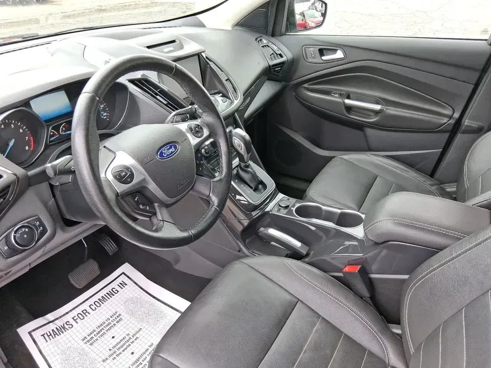 2014 Ford Escape Titanium (1FMCU9J99EU) with an 2.0L L4 DOHC 16V engine, 6-Speed Automatic transmission, located at 1099 N County Rd 25A , Troy, OH, 45373, (937) 908-9800, 40.057079, -84.212883 - Need one SUV that can handle an Ohio winter commute, school drop-offs, and a spontaneous weekend road trip to Hocking Hills without feeling like a compromise? This 2014 Ford Escape Titanium 4WD in sleek Tuxedo Black is built for real life in Troy-comfortable for long drives, confident in bad weather - Photo#9