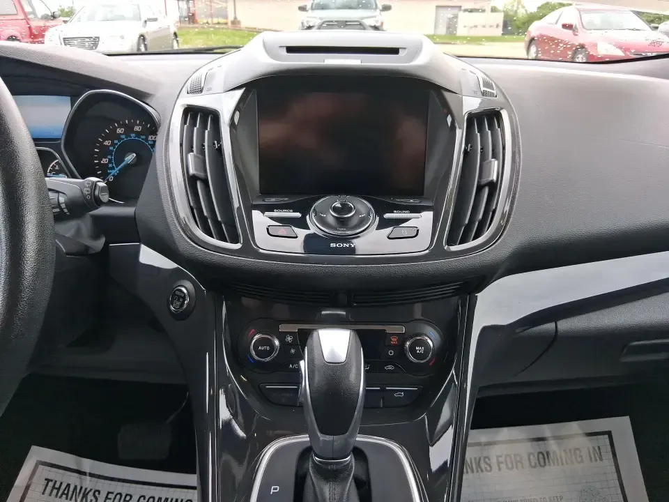 2014 Ford Escape Titanium (1FMCU9J99EU) with an 2.0L L4 DOHC 16V engine, 6-Speed Automatic transmission, located at 1099 N County Rd 25A , Troy, OH, 45373, (937) 908-9800, 40.057079, -84.212883 - Need one SUV that can handle an Ohio winter commute, school drop-offs, and a spontaneous weekend road trip to Hocking Hills without feeling like a compromise? This 2014 Ford Escape Titanium 4WD in sleek Tuxedo Black is built for real life in Troy-comfortable for long drives, confident in bad weather - Photo#13