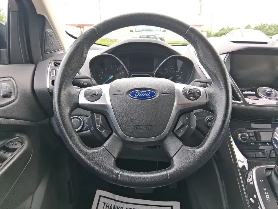 2014 Ford Escape Titanium (1FMCU9J99EU) with an 2.0L L4 DOHC 16V engine, 6-Speed Automatic transmission, located at 1099 N County Rd 25A , Troy, OH, 45373, (937) 908-9800, 40.057079, -84.212883 - Need one SUV that can handle an Ohio winter commute, school drop-offs, and a spontaneous weekend road trip to Hocking Hills without feeling like a compromise? This 2014 Ford Escape Titanium 4WD in sleek Tuxedo Black is built for real life in Troy-comfortable for long drives, confident in bad weather - Photo#16