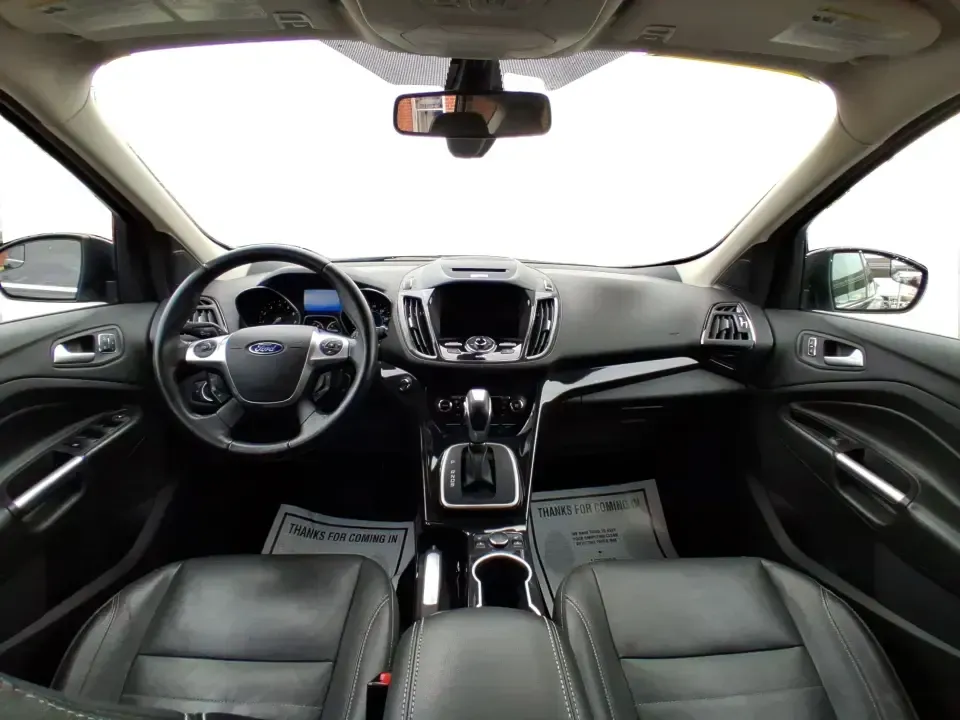 2014 Ford Escape Titanium (1FMCU9J99EU) with an 2.0L L4 DOHC 16V engine, 6-Speed Automatic transmission, located at 1099 N County Rd 25A , Troy, OH, 45373, (937) 908-9800, 40.057079, -84.212883 - Need one SUV that can handle an Ohio winter commute, school drop-offs, and a spontaneous weekend road trip to Hocking Hills without feeling like a compromise? This 2014 Ford Escape Titanium 4WD in sleek Tuxedo Black is built for real life in Troy-comfortable for long drives, confident in bad weather - Photo#21