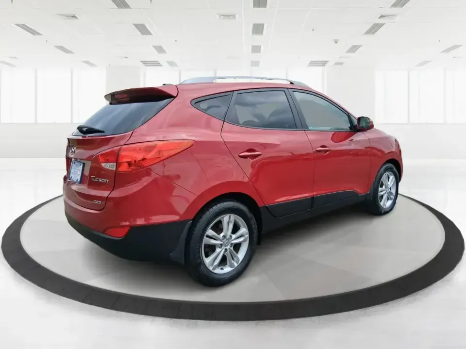 2013 Hyundai Tucson GLS (KM8JUCAC7DU) with an Theta II 2.4L I-4 DOHC engine, 6-Speed Automatic transmission, located at 1951 S Dayton Lakeview Rd., New Carlisle, OH, 45344, (937) 908-9800, 39.890999, -84.050255 - Need a dependable SUV that can handle Ohio weather, school drop-offs, and weekend getaways without stretching your budget? This 2013 Hyundai Tucson GLS in eye-catching Garnet Red is built for real life-comfortable for daily commuting, confident on slick winter roads, and practical for everything fro - Photo#2