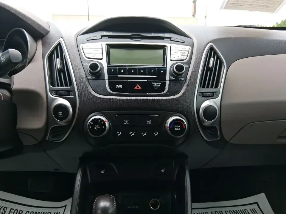 2013 Hyundai Tucson GLS (KM8JUCAC7DU) with an Theta II 2.4L I-4 DOHC engine, 6-Speed Automatic transmission, located at 1951 S Dayton Lakeview Rd., New Carlisle, OH, 45344, (937) 908-9800, 39.890999, -84.050255 - Need a dependable SUV that can handle Ohio weather, school drop-offs, and weekend getaways without stretching your budget? This 2013 Hyundai Tucson GLS in eye-catching Garnet Red is built for real life-comfortable for daily commuting, confident on slick winter roads, and practical for everything fro - Photo#13