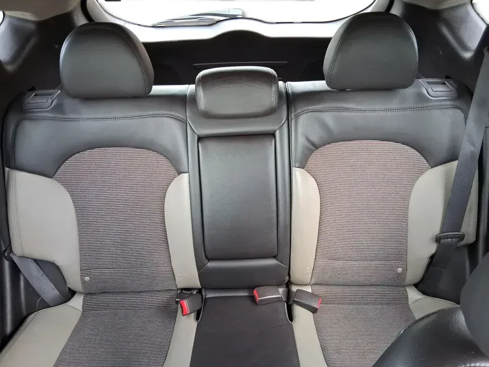 2013 Hyundai Tucson GLS (KM8JUCAC7DU) with an Theta II 2.4L I-4 DOHC engine, 6-Speed Automatic transmission, located at 1951 S Dayton Lakeview Rd., New Carlisle, OH, 45344, (937) 908-9800, 39.890999, -84.050255 - Need a dependable SUV that can handle Ohio weather, school drop-offs, and weekend getaways without stretching your budget? This 2013 Hyundai Tucson GLS in eye-catching Garnet Red is built for real life-comfortable for daily commuting, confident on slick winter roads, and practical for everything fro - Photo#14