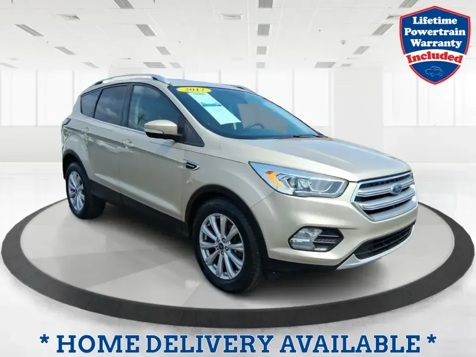 2017 Ford Escape Titanium (1FMCU9JD2HU) with an 1.5L L4 DOHC 16V engine, 6A transmission, located at 1230 East Main St, Xenia, OH, 45385, (937) 908-9800, 39.688026, -83.910172 - Whether you're a busy commuter running up and down US-35, a growing family juggling school drop-offs, or a weekend explorer heading out toward John Bryan State Park, this 2017 Ford Escape Titanium is the kind of compact SUV that fits real life in Xenia. With confident AWD capability, upscale comfort - Photo#0
