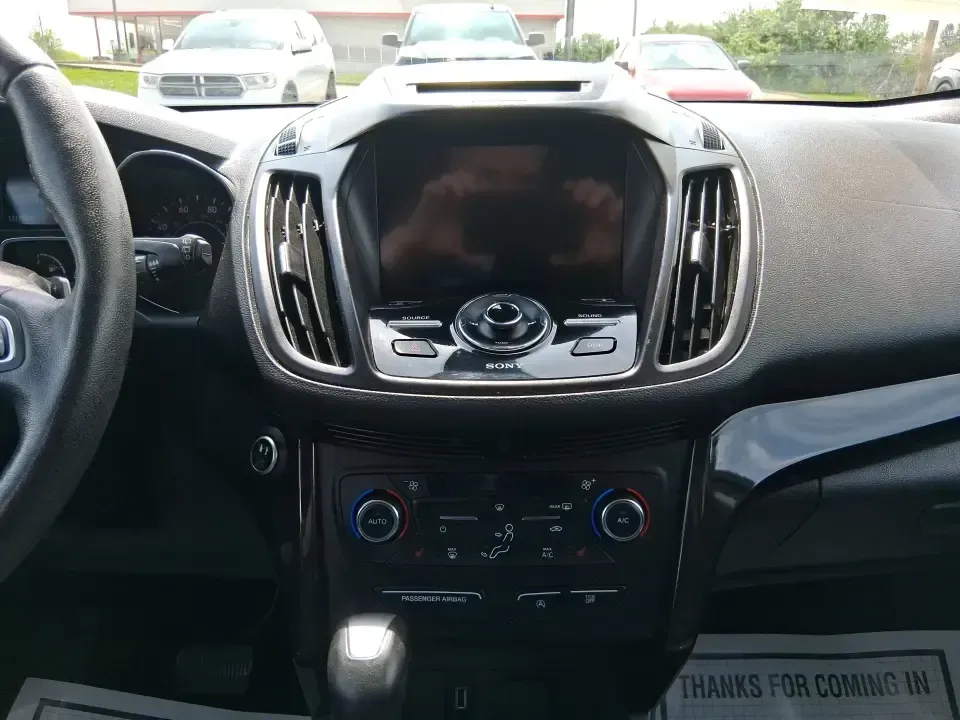 2017 Ford Escape Titanium (1FMCU9JD2HU) with an 1.5L L4 DOHC 16V engine, 6A transmission, located at 1230 East Main St, Xenia, OH, 45385, (937) 908-9800, 39.688026, -83.910172 - Whether you're a busy commuter running up and down US-35, a growing family juggling school drop-offs, or a weekend explorer heading out toward John Bryan State Park, this 2017 Ford Escape Titanium is the kind of compact SUV that fits real life in Xenia. With confident AWD capability, upscale comfort - Photo#13