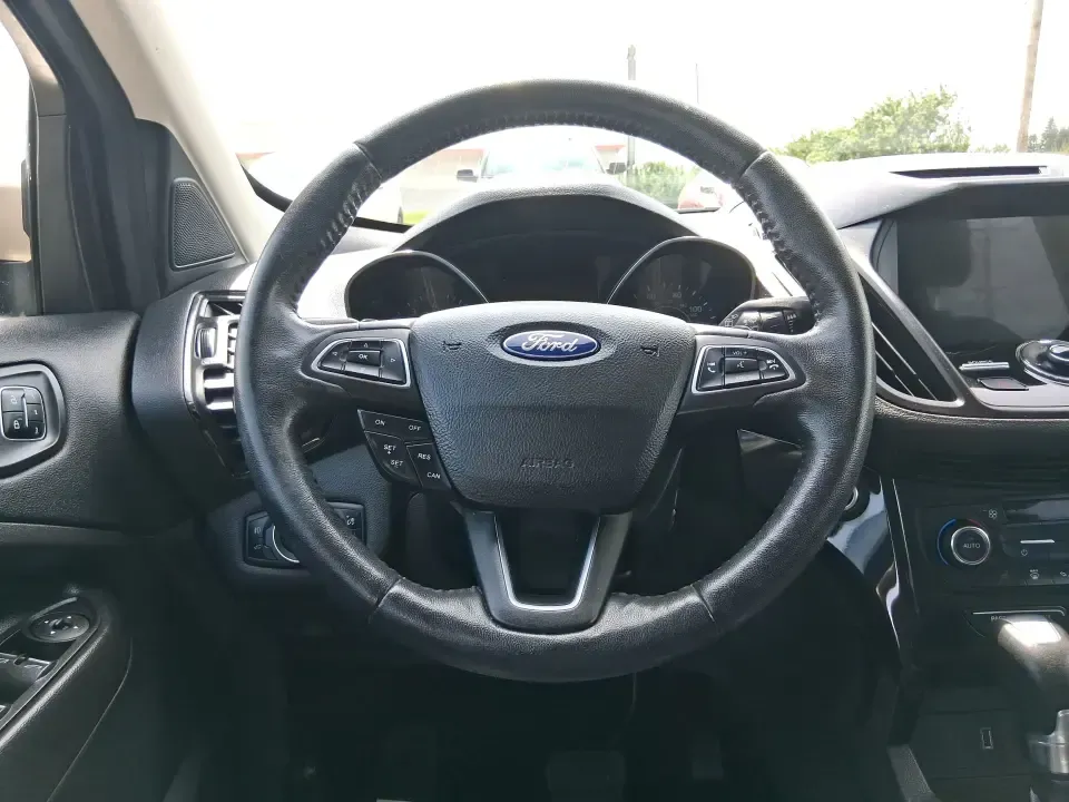 2017 Ford Escape Titanium (1FMCU9JD2HU) with an 1.5L L4 DOHC 16V engine, 6A transmission, located at 1230 East Main St, Xenia, OH, 45385, (937) 908-9800, 39.688026, -83.910172 - Whether you're a busy commuter running up and down US-35, a growing family juggling school drop-offs, or a weekend explorer heading out toward John Bryan State Park, this 2017 Ford Escape Titanium is the kind of compact SUV that fits real life in Xenia. With confident AWD capability, upscale comfort - Photo#16