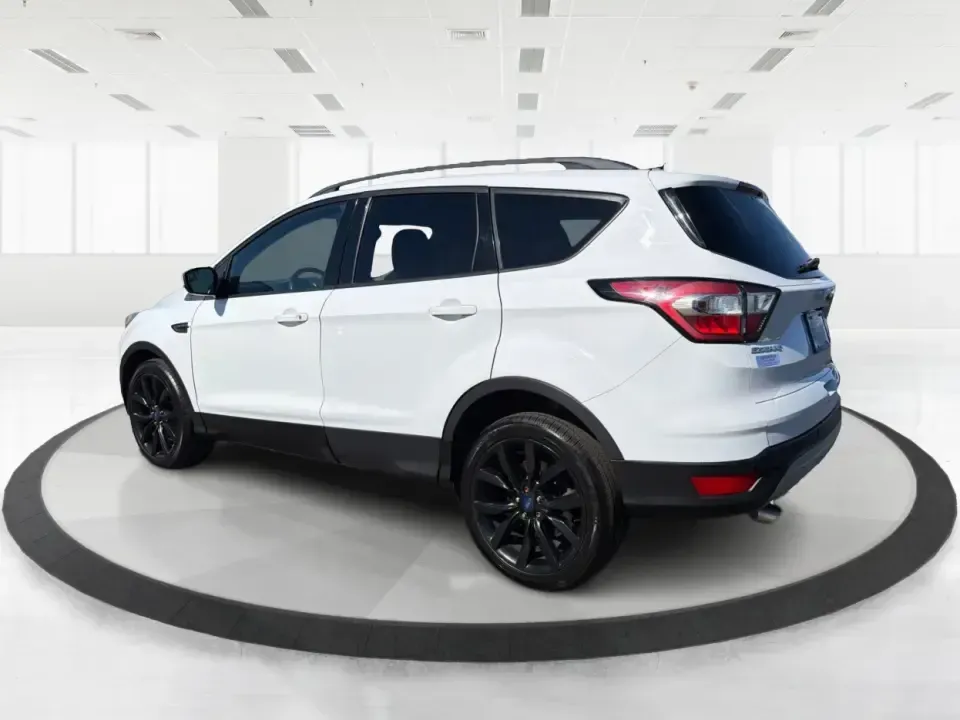 2017 Ford Escape SE (1FMCU0GD2HU) with an 1.5L L4 DOHC 16V engine, 6A transmission, located at 401 Woodman Dr, Riverside, OH, 45431, (937) 908-9800, 39.760899, -84.123421 - Picture a weekday that starts with a smooth commute up N County Rd 25A, turns into easy school drop-offs, and ends with a weekend escape to Indian Lake or a quick run down I75 for shopping and dinner-this 2017 Ford Escape SE is built for real life in and around Piqua, Ohio. Finished in standout Whit - Photo#4