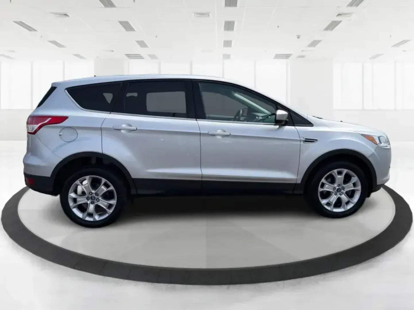 2015 Ford Escape SE (1FMCU9G98FU) with an 2.0L L4 DOHC 16V engine, 6-Speed Automatic transmission, located at 1099 N County Rd 25A , Troy, OH, 45373, (937) 908-9800, 40.057079, -84.212883 - Weekday commutes down I75, school drop-offs around Troy City Schools, and spontaneous weekend trips to Charleston Falls Preserve all get easier when you have an SUV that's the right size, the right power, and the right fit for your budget. This 2015 Ford Escape SE in Ingot Silver is built for real-l - Photo#1