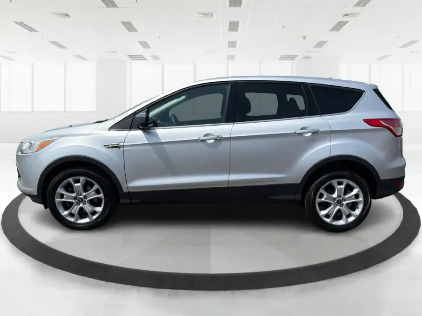 2015 Ford Escape SE (1FMCU9G98FU) with an 2.0L L4 DOHC 16V engine, 6-Speed Automatic transmission, located at 1099 N County Rd 25A , Troy, OH, 45373, (937) 908-9800, 40.057079, -84.212883 - Weekday commutes down I75, school drop-offs around Troy City Schools, and spontaneous weekend trips to Charleston Falls Preserve all get easier when you have an SUV that's the right size, the right power, and the right fit for your budget. This 2015 Ford Escape SE in Ingot Silver is built for real-l - Photo#5